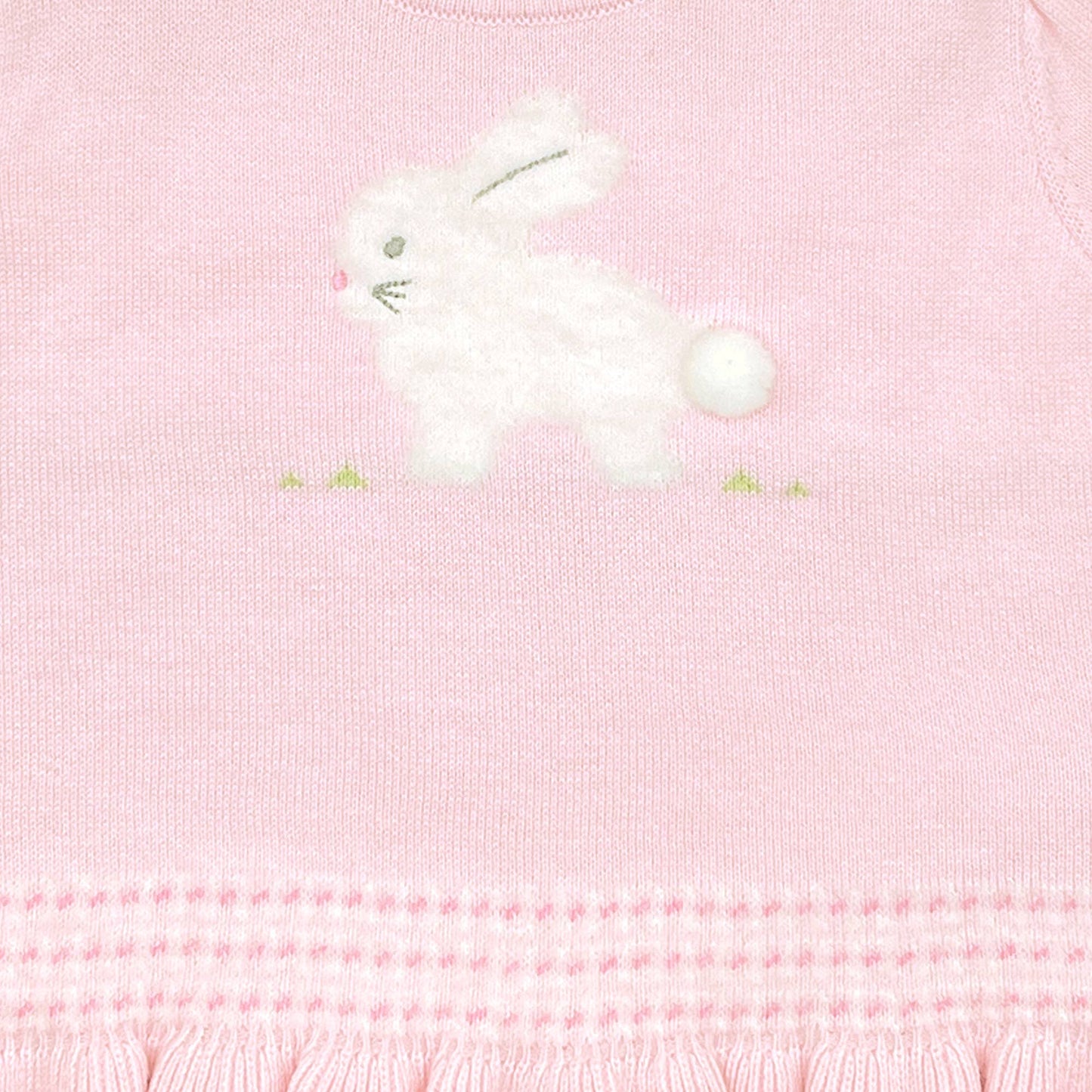 A close-up image of the Fuzzy Bunny Lightweight Knit Sweater in Pink featuring a white embroidered bunny with a fluffy tail and green accents around it, crafted from 100% cotton yarns.