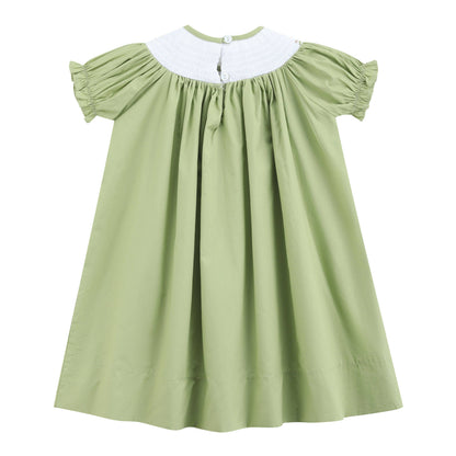 Short-sleeved pistachio green girls’ dress with white pleated yoke, gathered sleeves and neckline, and two back collar buttons. Size: 18-24M.