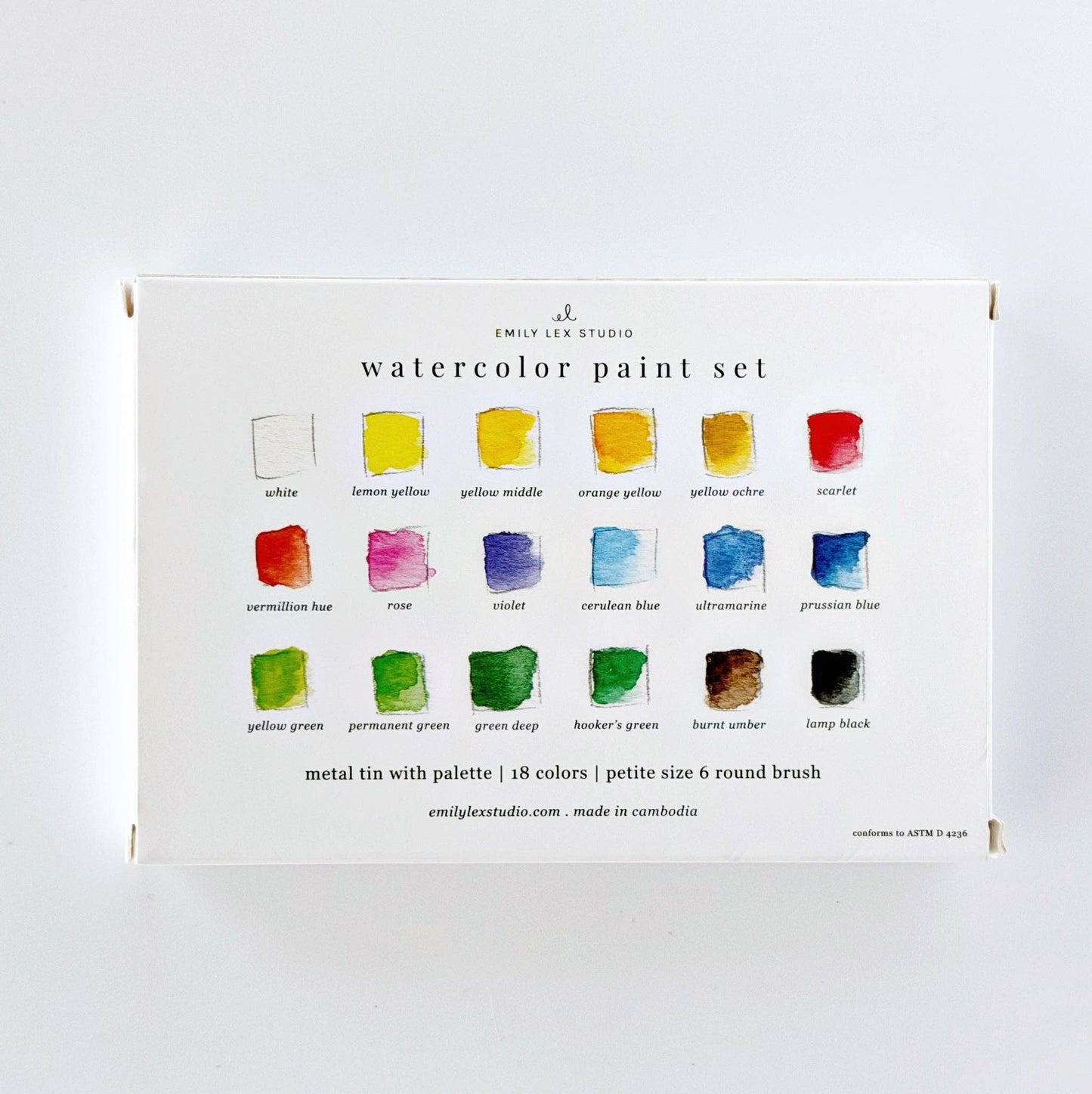 Watercolor paint set by Emily Lex Studio with 18 labeled color swatches in a compact white box, includes round brush. Sizes available: single standard travel kit.