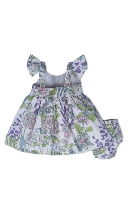 Shay Floral Dress in Lavender: baby dress with flutter sleeves, matching bloomers, purple/green/blue floral print. Sizes 0-24M.