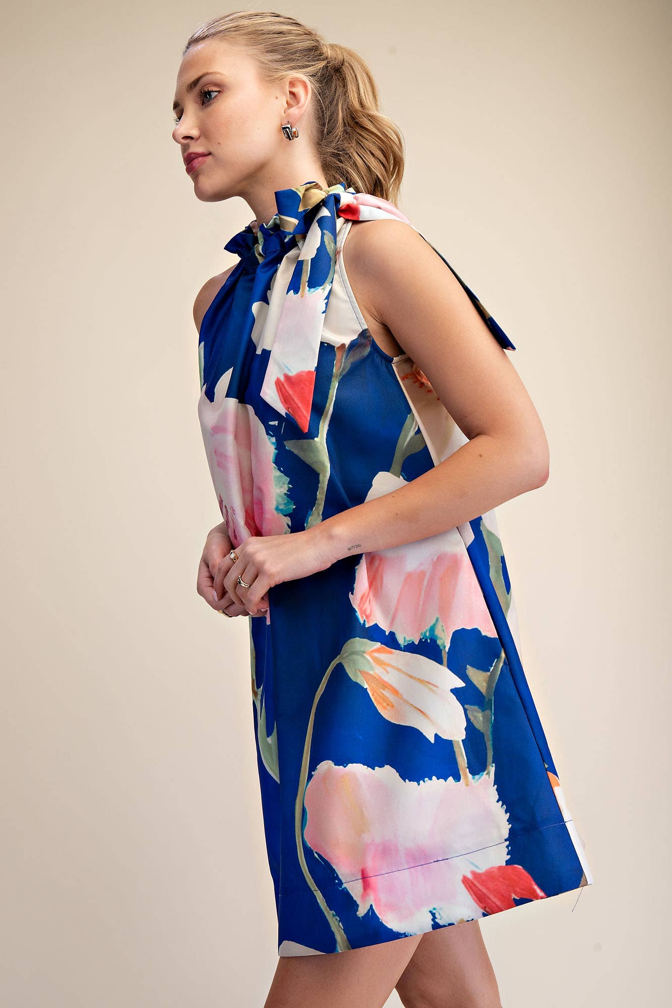 Mini Dress Ruffle Neck Tie Sleeveless Floral Print in Royal, knee-length, large bow on shoulder. Sizes: S, M, L, XL.