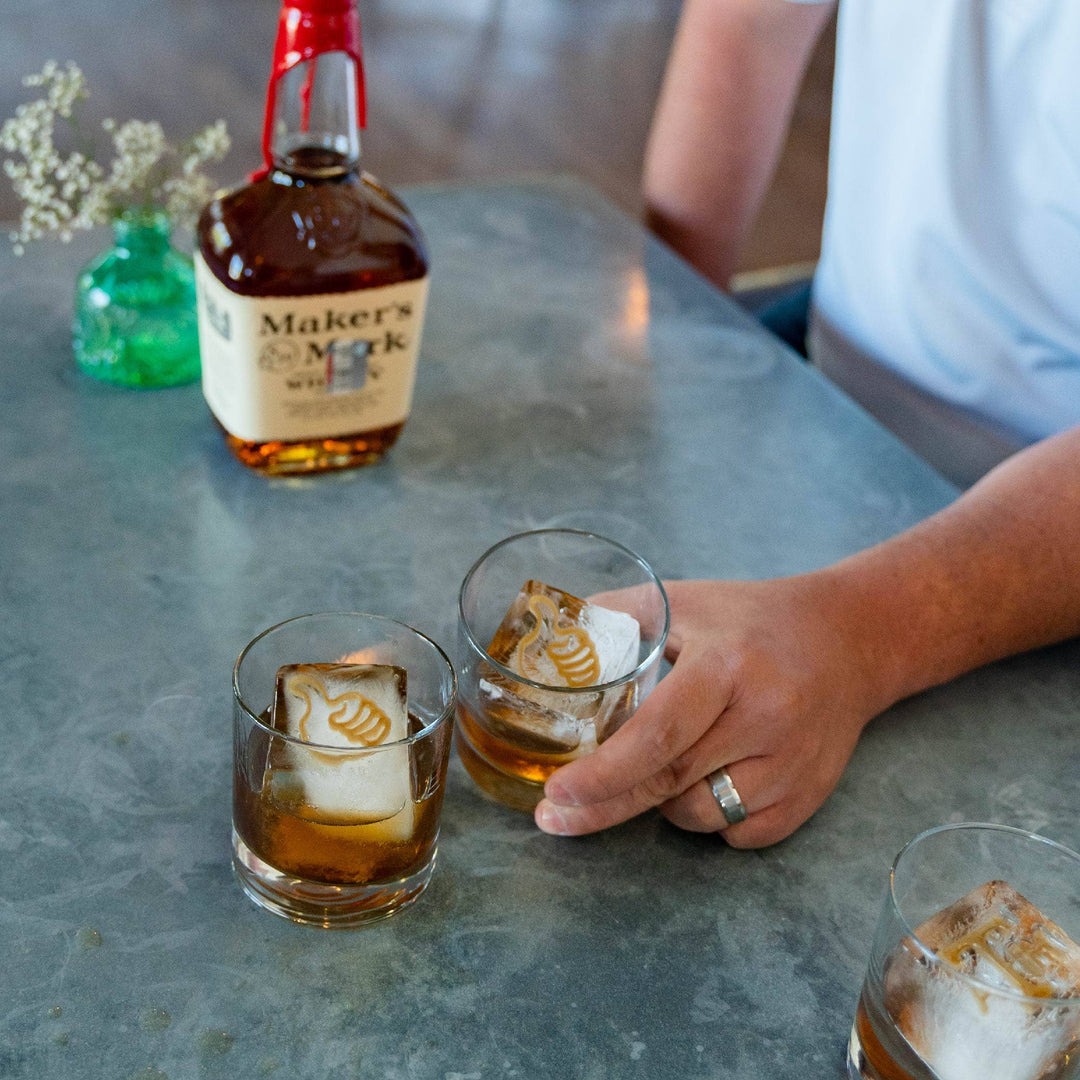 Texas A&amp;M Thumb Insert shown in whiskey glass; available in 3-pack. Compact size fits standard drinkware.