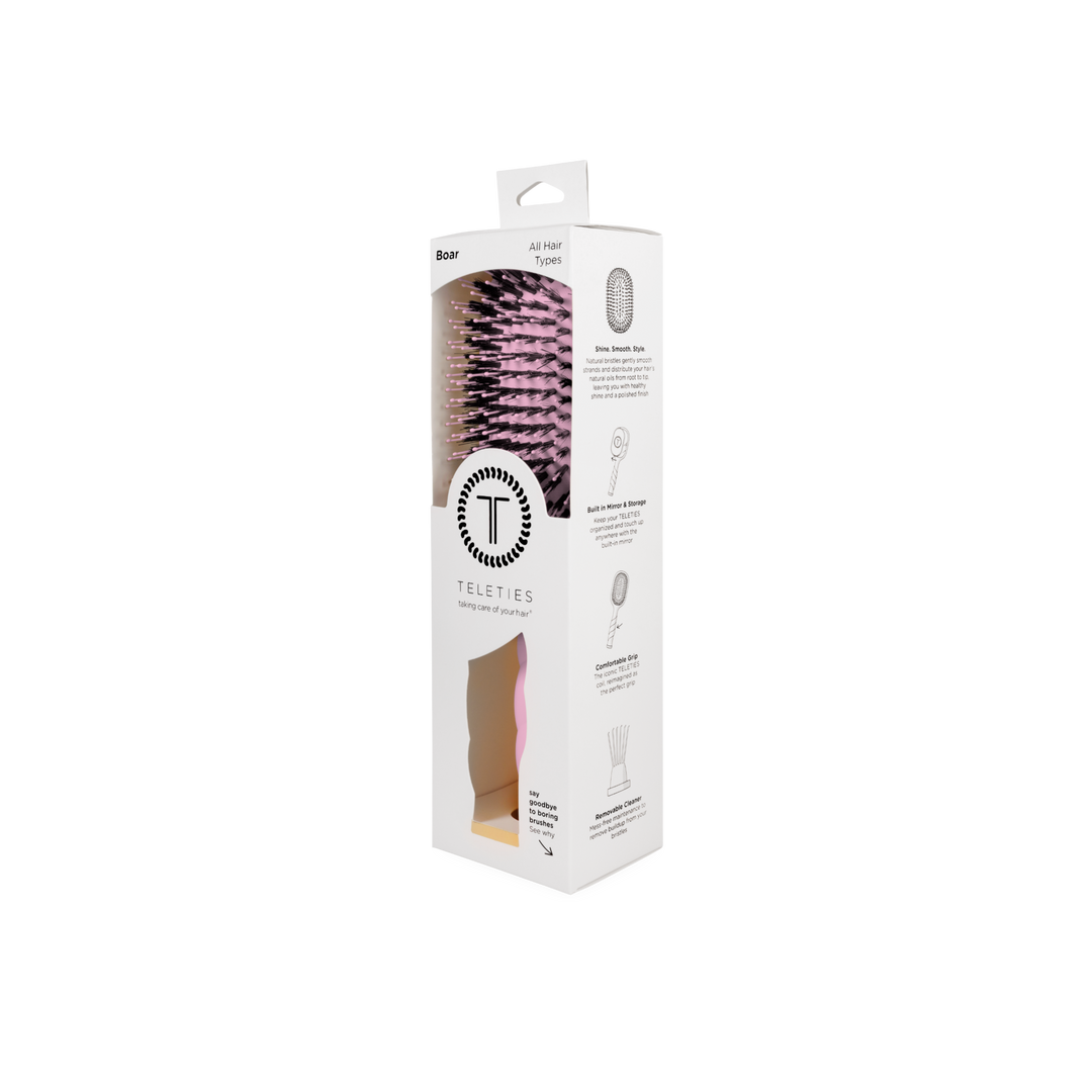 Bubblegum pink boar bristle hair brush.