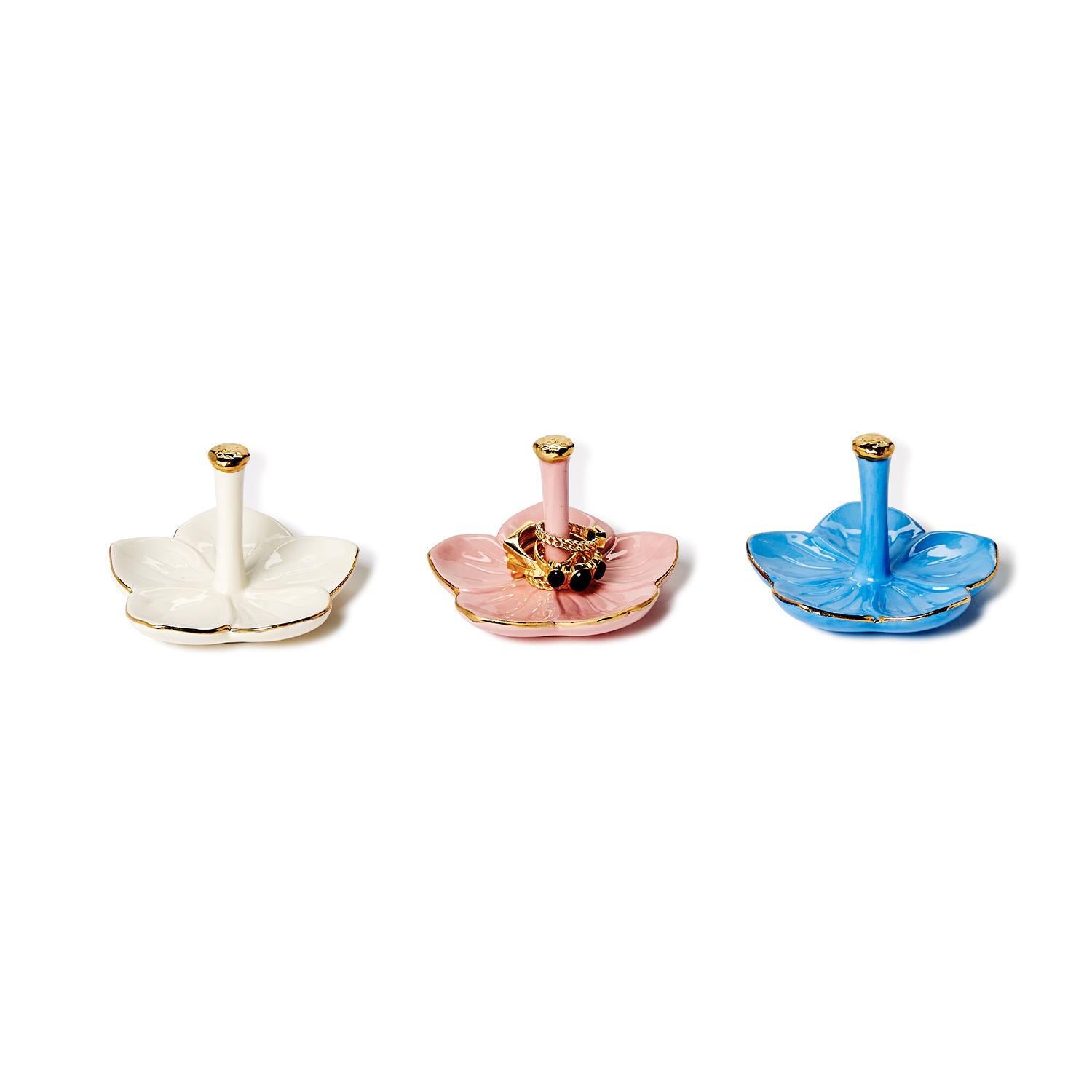 Flower Haven Ceramic Ring Holders in white, pink, or blue with gold accents; flower-shaped; central rod; sizes S, M, L.