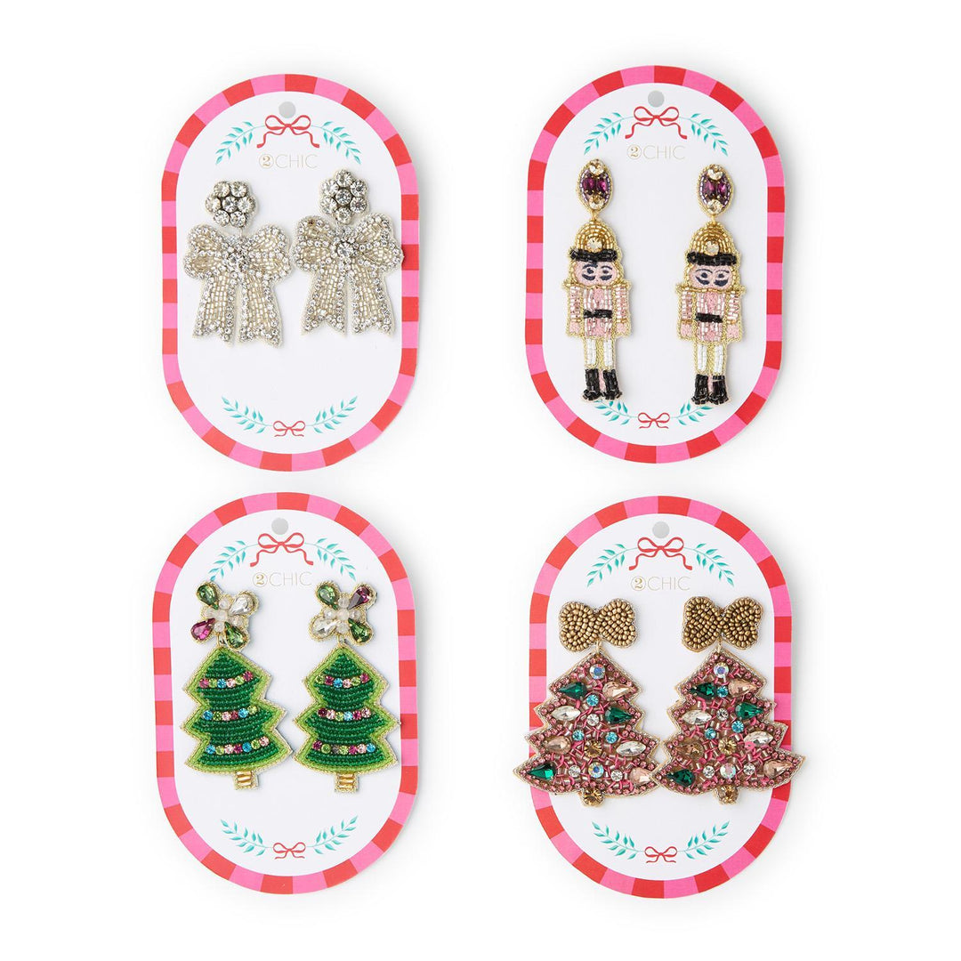 Holiday Icon Earrings featuring four pairs of festive dangle earrings shaped like bows, nutcrackers, and Christmas trees.