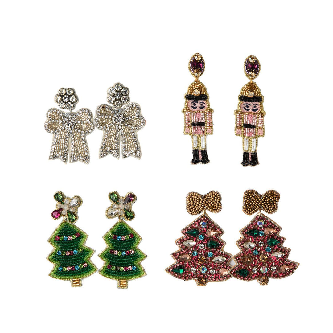 Holiday Icon Earrings featuring four dangle designs: silver bows, nutcrackers, and green or red Christmas trees.