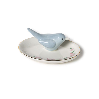 Ceramic ring holder with light blue bird, gold rim, pink floral pattern. Available in small and medium sizes.