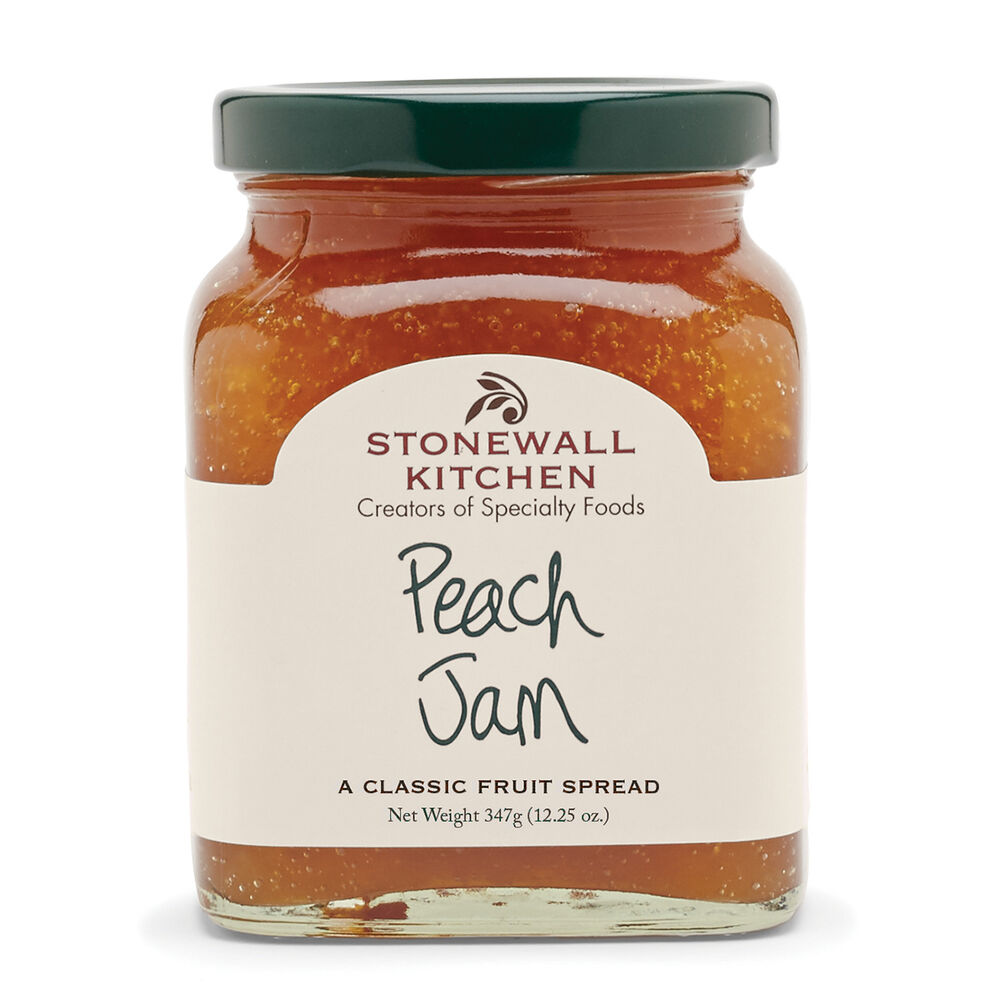 12.25 oz jar of peach jam with green lid and white label; golden-orange gluten-free spread. Only available in 12.25 oz size.