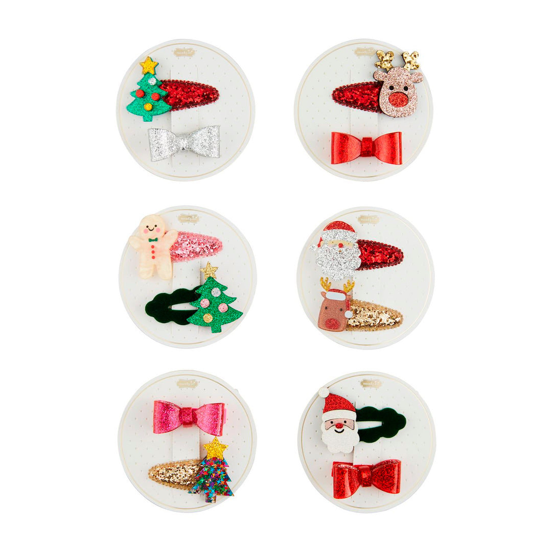 Six Christmas hair clip sets, each with two glittery clips featuring Christmas trees, reindeer, Santa Claus, and bows.