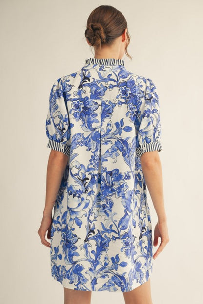 Royal Blue Floral Dress with blue floral print, vertical striped trim, side pockets. Available in sizes XS-XL.