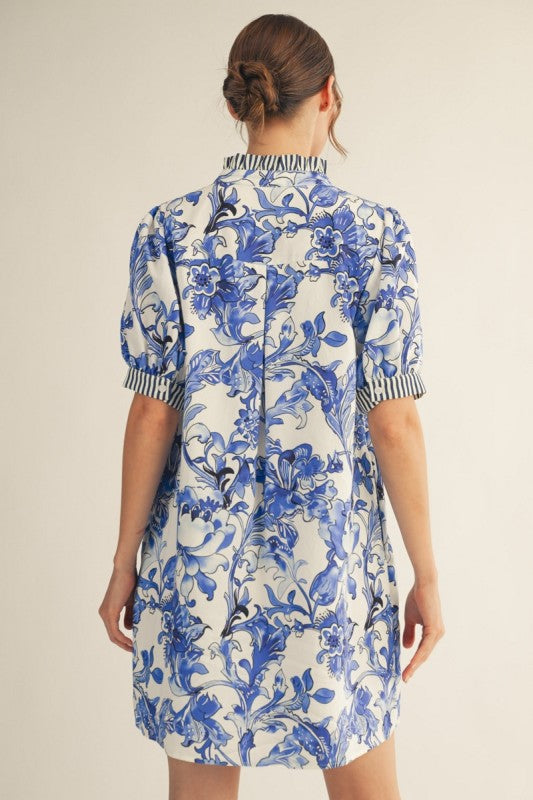 Royal Blue Floral Dress with blue floral print, vertical striped trim, side pockets. Available in sizes XS-XL.