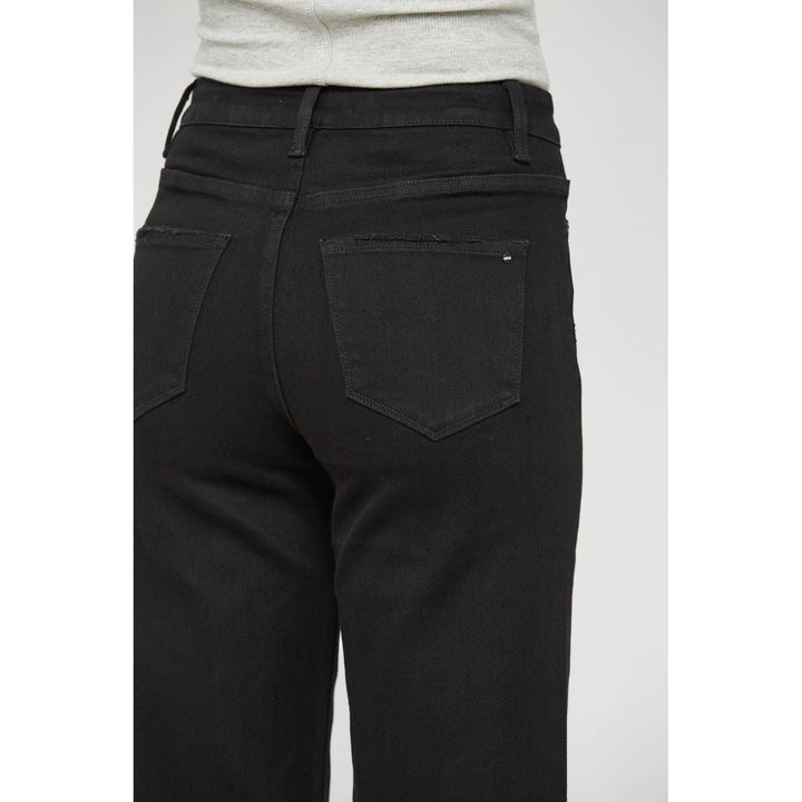 WIDE LEG CROP: BLACK BEAUTY / 28 cropped wide-leg jeans in Black Mica Denim with back pockets and a frayed hem. Available in size 28.