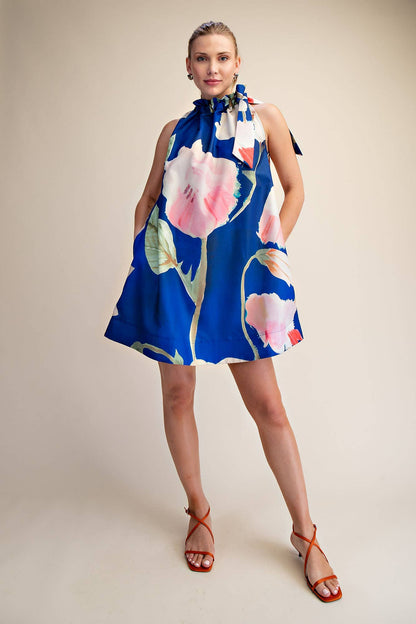 Mini Dress Ruffle Neck Tie Sleeveless Floral Print in Royal, size M. Features: pockets, floral pattern. Sizes: XS-XL.