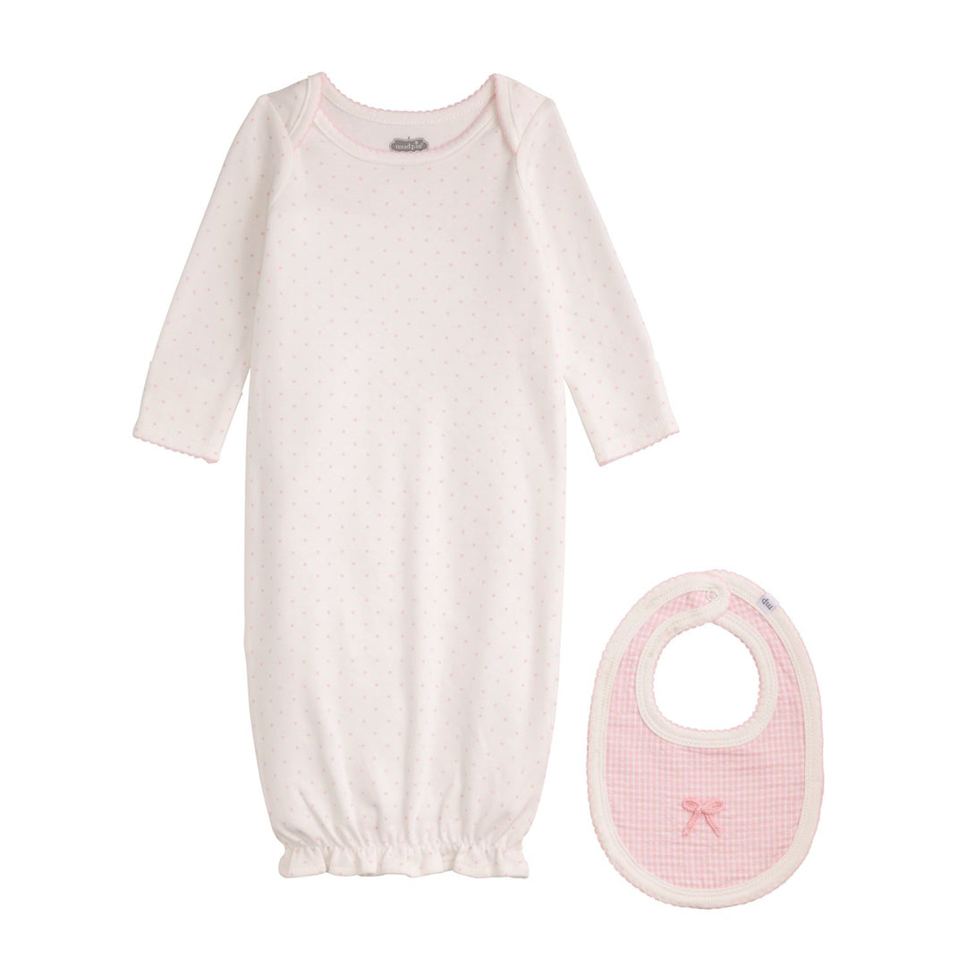 White newborn gown with pink polka dots, ruffled bottom, and matching gingham bib. Sizes: newborn only.