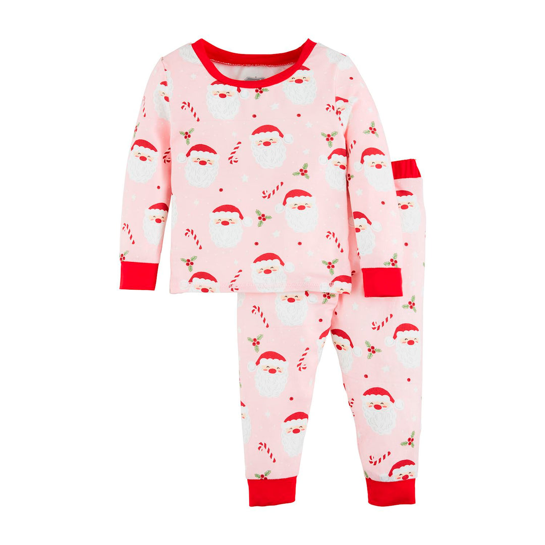 Pink Santa Glow Pajama Set with Santa, candy cane, and holly print, featuring red trim at the neck, cuffs, and ankles. Sizes available.