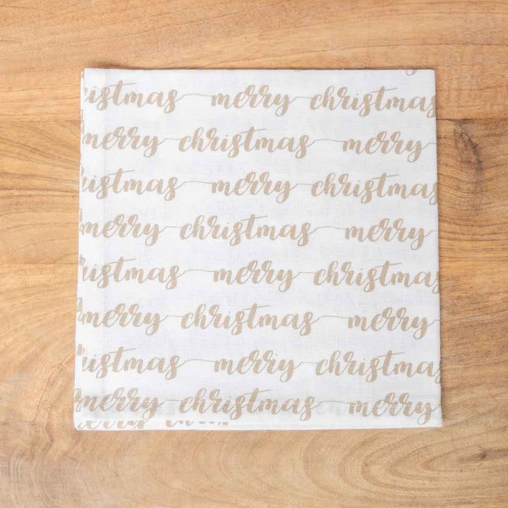 White Christmas hand towel with repeating metallic gold “merry christmas” script.