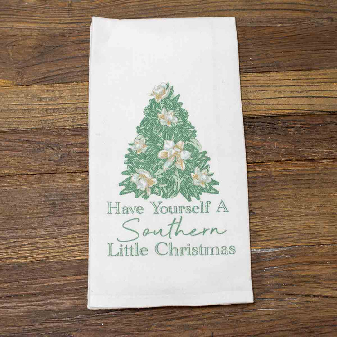 White Christmas Hand Towel with green pine tree, white flowers, and “Have Yourself A Southern Little Christmas” text. Available in multiple sizes.