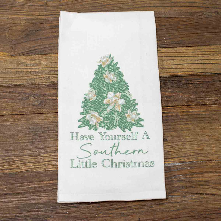 White Christmas Hand Towel with green pine tree, white flowers, and “Have Yourself A Southern Little Christmas” text. Available in multiple sizes.