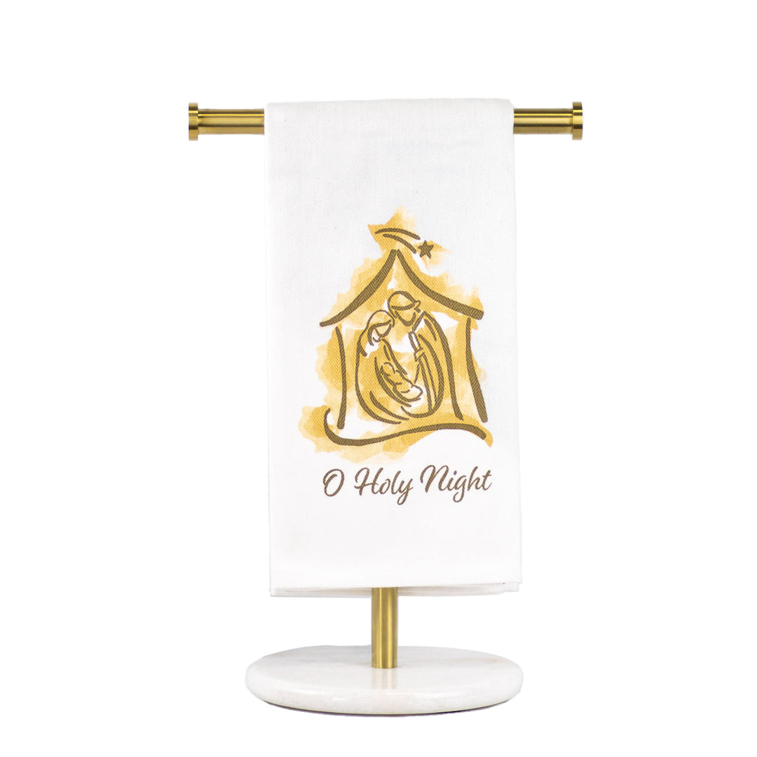 White Christmas hand towel with gold watercolor Nativity scene and “O Holy Night” text.