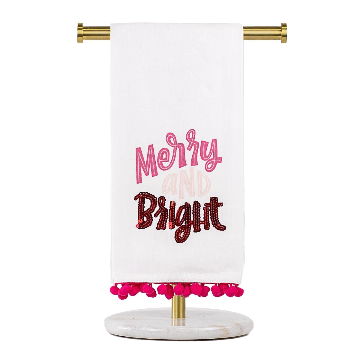 The Merry & Bright Pom Pom Hand Towel features "Merry and Bright" in pink and red on a towel with pink pom-poms. Sizes available: Standard.