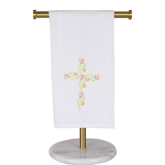 The Tulip Cross Flour Sack Hand Towel is a white cotton towel with a floral cross design. Available in standard size, it's machine washable for easy care.