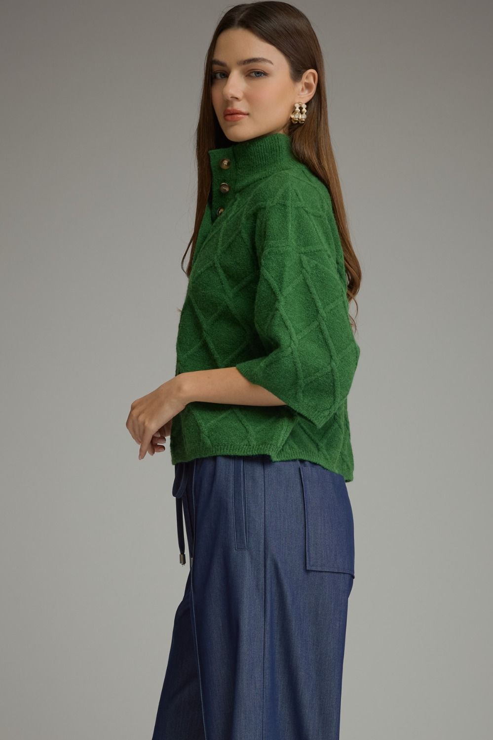 Green diamond textured sweater with stand collar and elbow-length sleeves. Available in all sizes.