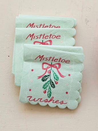Pale green Mistletoe Wishes scalloped cocktail napkins with mistletoe illustration.