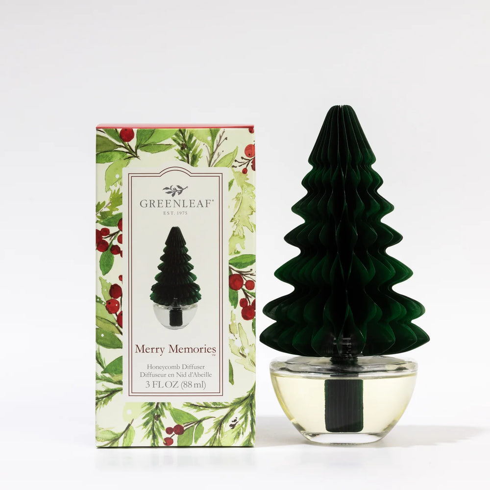 Green Merry Memories Honeycomb Diffuser with honeycomb-style paper design and glass base.