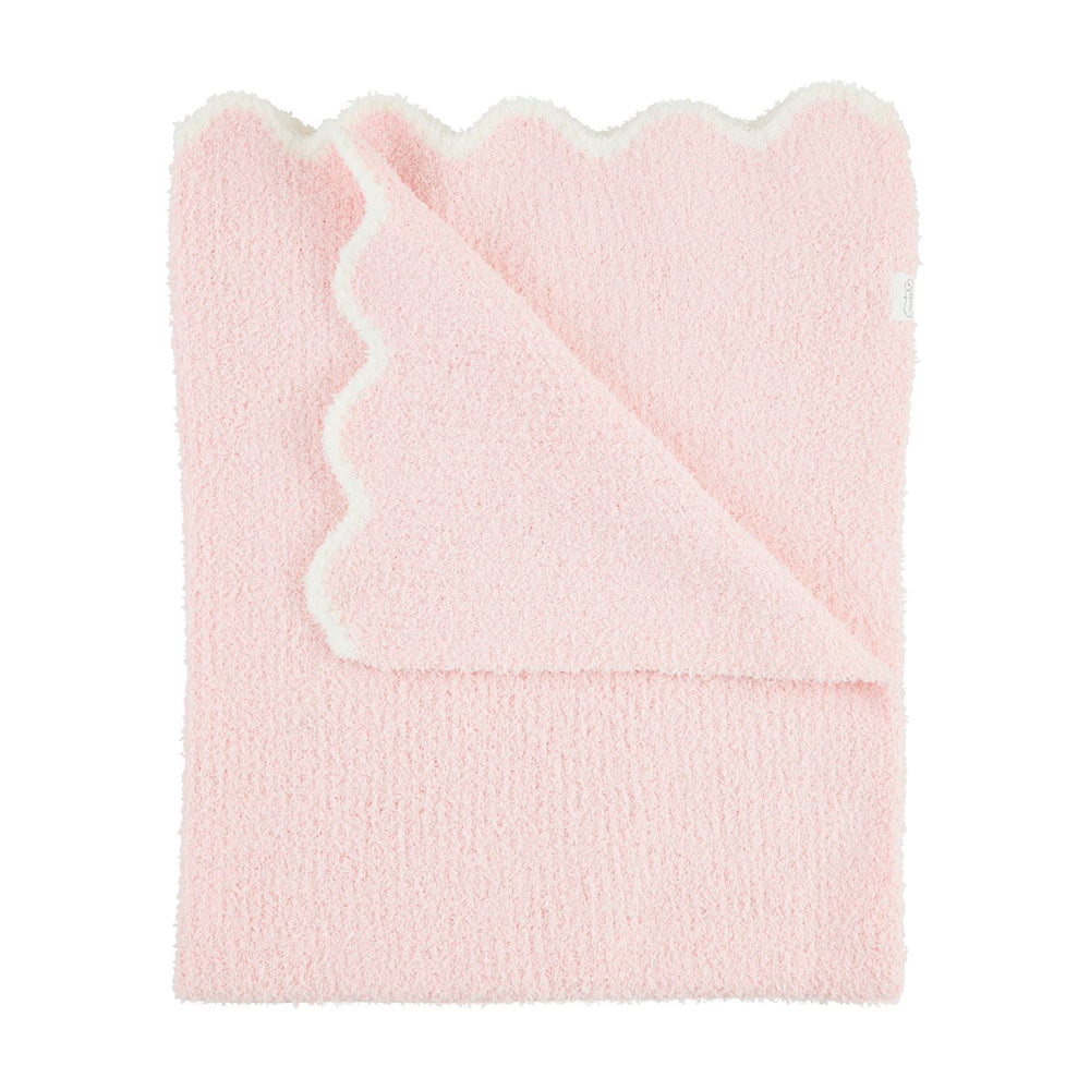 The Scallop Chenille Blanket in soft pink features scalloped edges and a plush white underside. Its knit chenille texture offers warmth and comfort. Available sizes: 50" x 60".