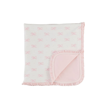 Soft white cotton blanket with pink bow pattern, ruffled edges, solid pink underside. Available in sizes S, M, L.