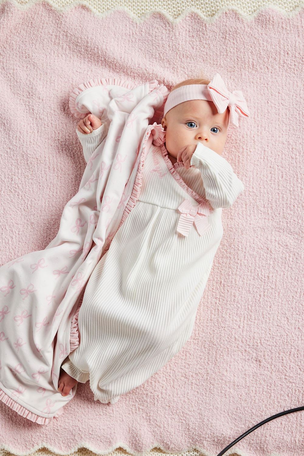 Pink Baby Arrival Blanket with ruffle edges and pink bow designs. Available in 30"x40" and 40"x60" sizes.