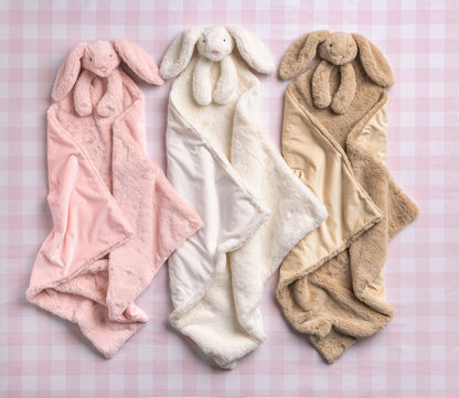 Cuddle Plush Blankets in pink, white, and beige with matching bunny plush. Available in S, M, L. Soft faux fur with bunny head.