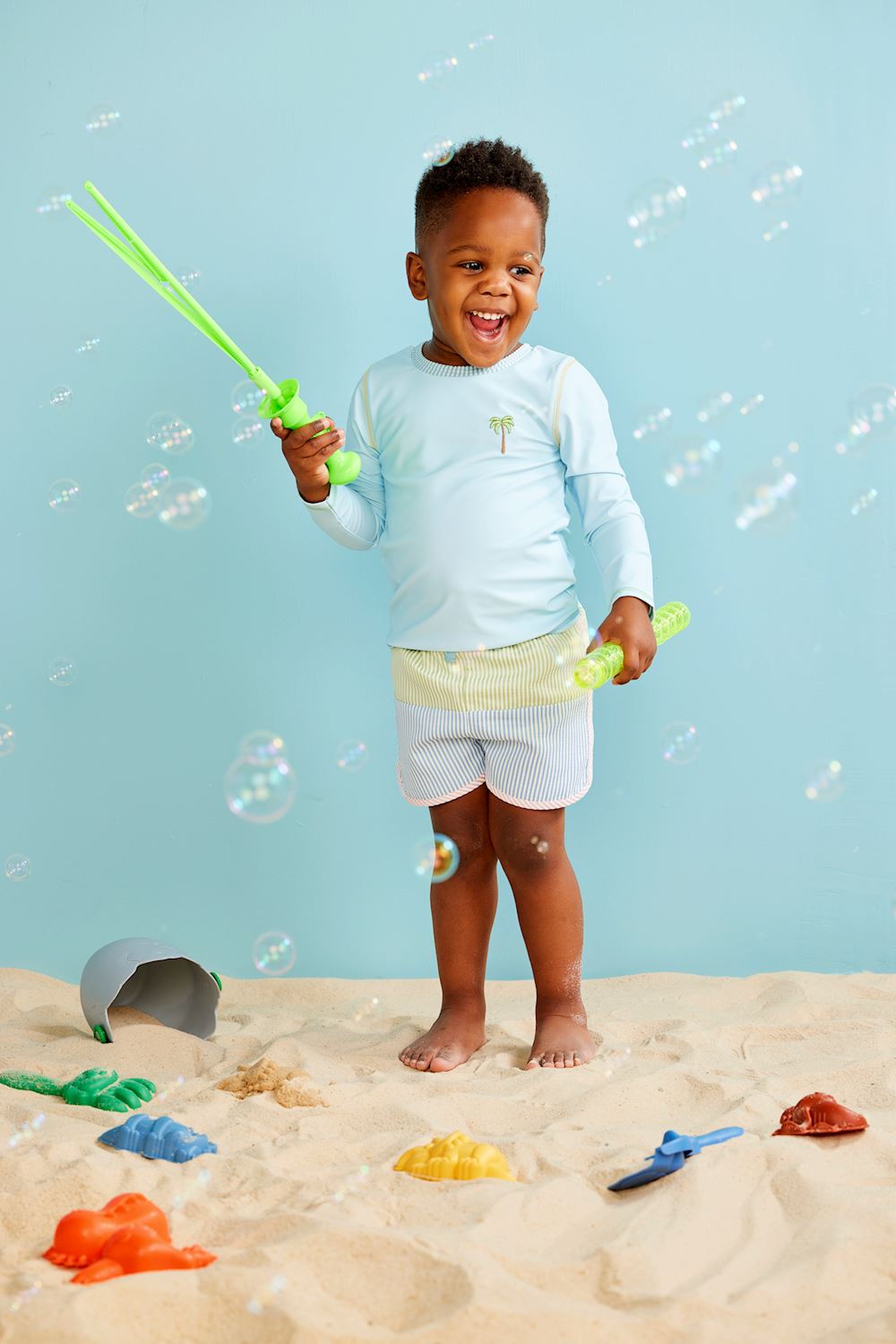 Seersucker Rash Guard & Swim Trunks Set: A playful swim set for kids featuring a coordinating rash guard and swim trunks. Sizes available: 2T, 3T, 4T, 5T, 6, 7.