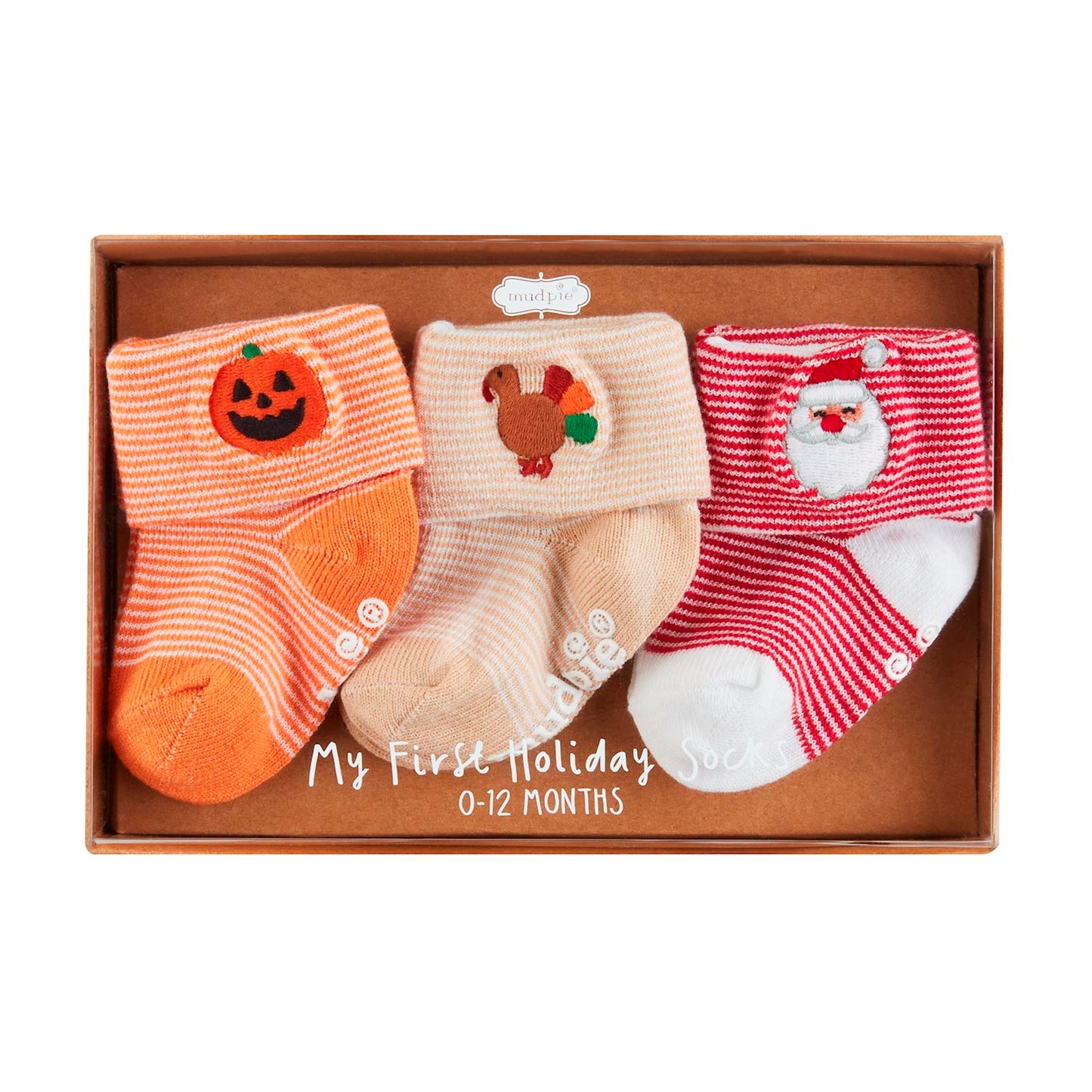 **My First Holiday Sock Set**

Three pairs of cotton hosiery socks for ages 0-12 months. Includes:
- Orange pair with pumpkin (Halloween)
- Beige pair with turkey (Thanksgiving)
- Red and white striped pair with Santa Claus (Christmas)