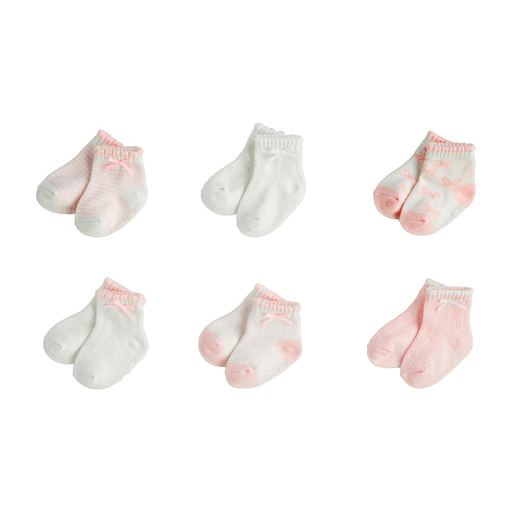 The Bow Baby Socks set features six pairs of soft, cotton hosiery infant socks. Each pair includes unique pink and white designs with stripes, solid colors, and grosgrain bows. Available in sizes for infants.