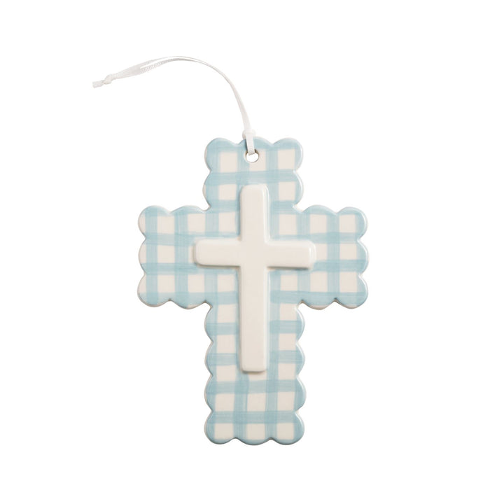 Hand-painted ceramic cross with blue plaid, raised white center, scalloped edges, and a white cord. Available in two sizes.