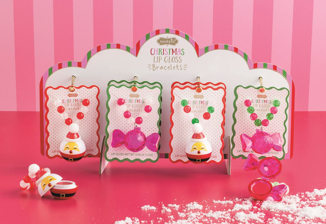 Four Christmas lip gloss bracelets in four styles, featuring two Santa charms and two candy charms.