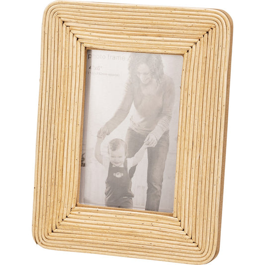 Rattan Photo Frame: Holds a black-and-white photo. Layered, textured design with bohemian style. Sizes available: 4x6, 5x7, 8x10.