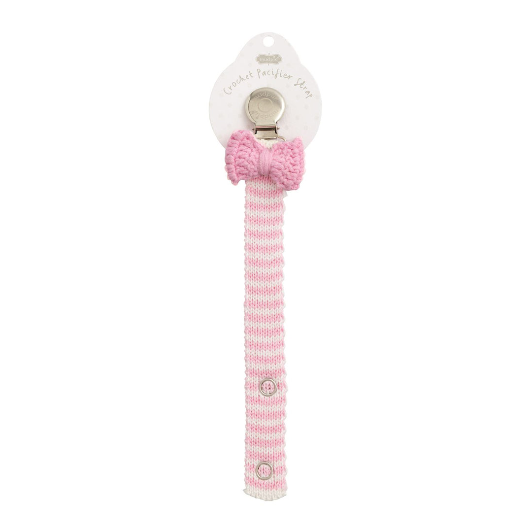 Pink and white crochet pacifier clip with pink bow, button closure. Available in 12 styles. Size info not shown.