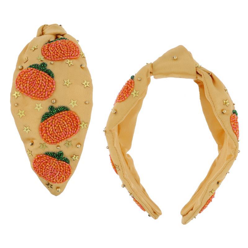 Yellow knotted headband with orange beaded pumpkins and gold star sequins. Sizes: S, M, L. Side and top views shown.