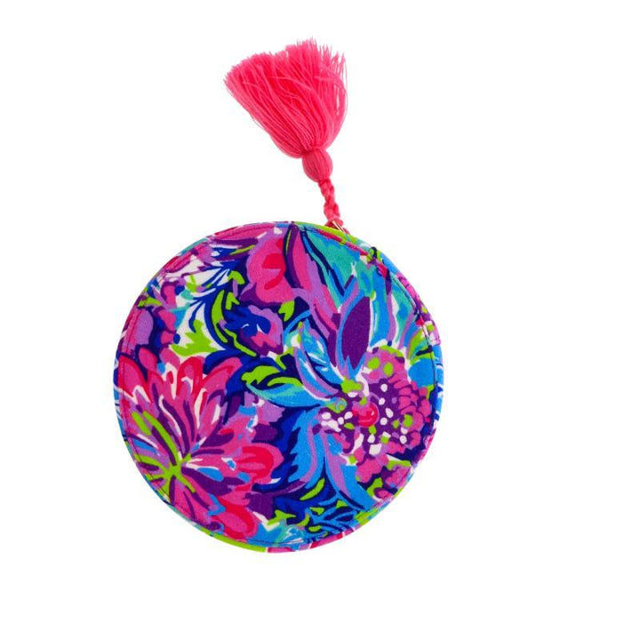 Round viscose velvet jewelry case, floral print in pink, blue, green, purple with pink tassel. Sizes: small, medium.