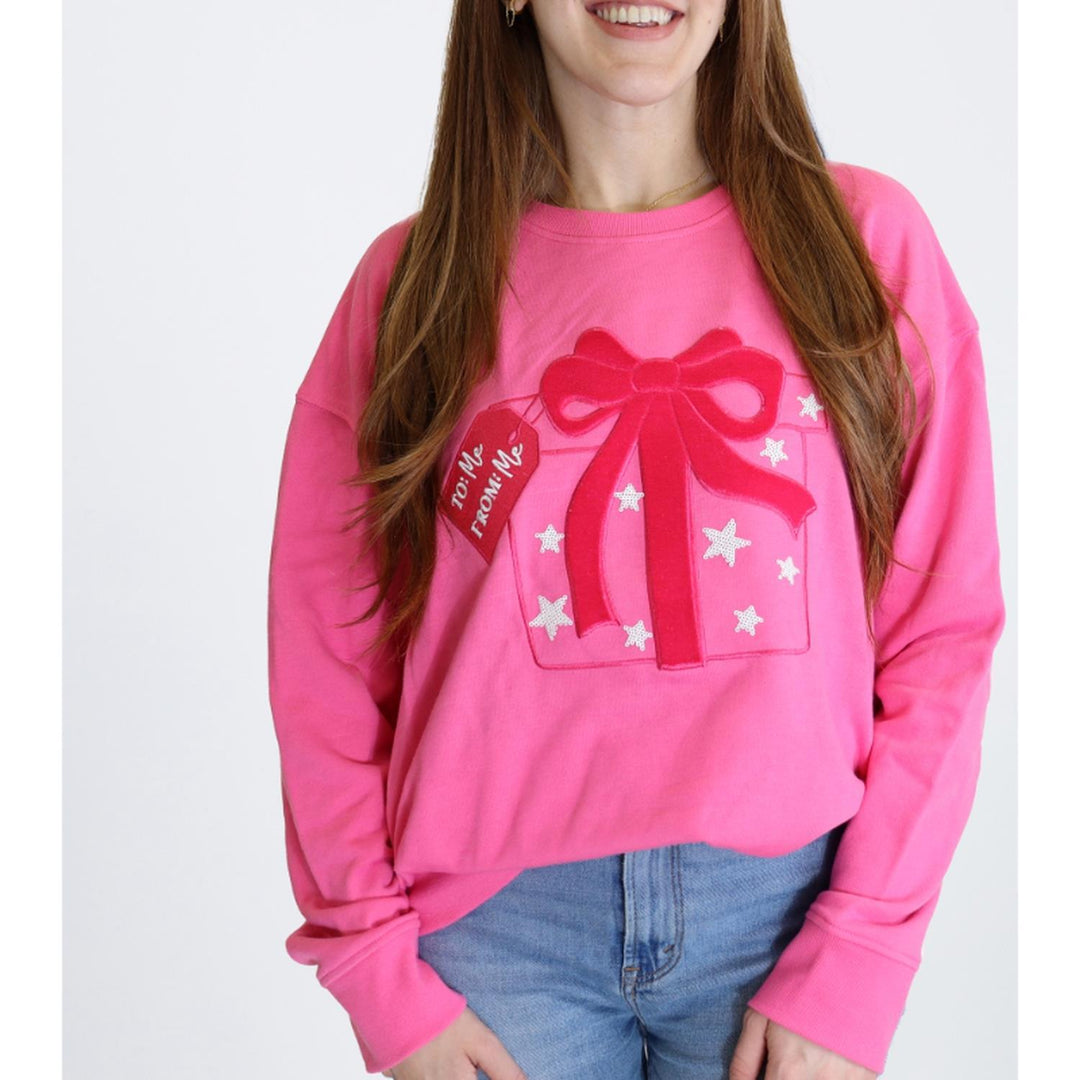 Pink Best Present Ever sweatshirt with a gift box graphic, red bow, and “To: Me From: Me” tag. Available in various sizes.