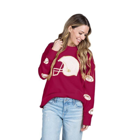 Team Pride Maroon Sweatshirt with large football helmet design and smaller footballs on sleeves. Sizes: S, M, L, XL.
