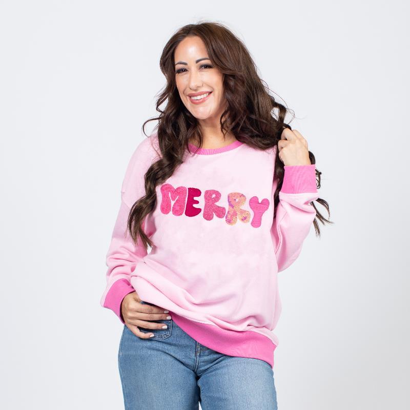 The Merry Pink Sequin Sweatshirt features a vibrant pink color adorned with shimmering sequins for a festive touch. Available sizes: S, M, L, XL.