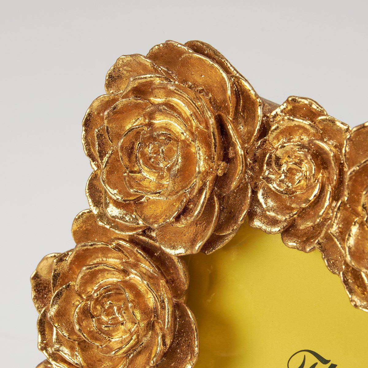 Gold Rose Photo Frame: Features an ornate corner with sculpted roses and detailed petals on a soft yellow background. Available sizes: 4x6, 5x7 inches.