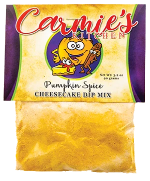 Carmie’s Pumpkin Spice Cheesecake Dip Mix in a clear pouch with cartoon pumpkin and cheesecake on the label; yellow-tinted powder blend of pumpkin and cinnamon flavors. Available in standard packet size.