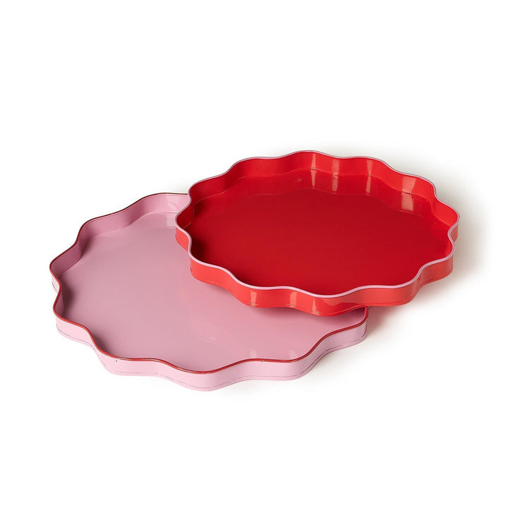 Red and light pink round, scalloped-edge metal Scalloped Trays.