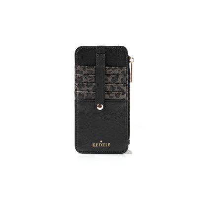 Kedzie Essentials Only Zippered Wallet Open Stock in Amalfi style with black vegan leather, gold lettering, three leopard-print card slots, snap strap closure, and right-side zippered compartment. Sizes available: Small, Medium, Large.