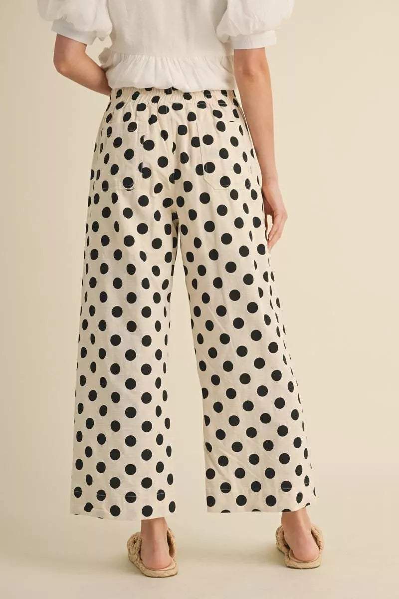 Cream wide leg pants with black polka dots, soft cotton-rayon-linen blend. Available in sizes XS-XL.