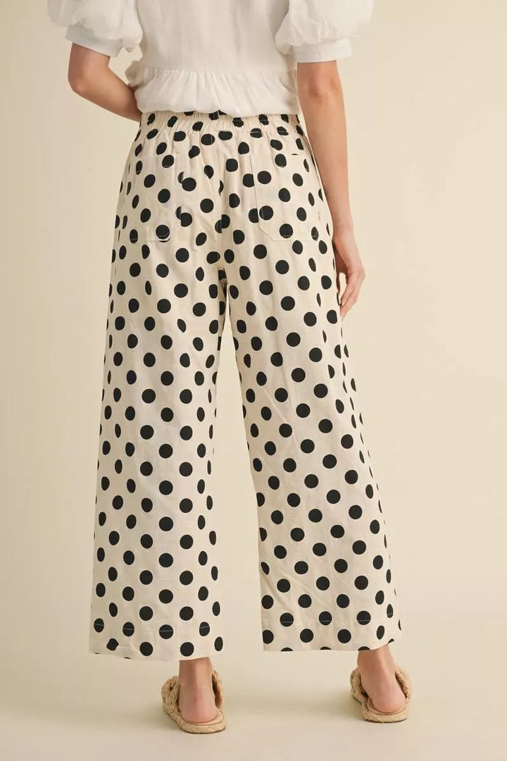 Cream wide leg pants with black polka dots, soft cotton-rayon-linen blend. Available in sizes XS-XL.